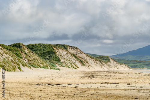 Five Finger Strand, one of the most famous beaches in Inishowen known for its pristine sand and rocky coastline with some of the highest sand dunes in Europe, county Donegal, Ireland. photo