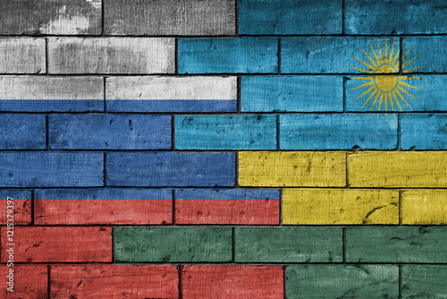 colourful painted big flag of russia and flag of rwanda on a massive old brick wall background. concept photo