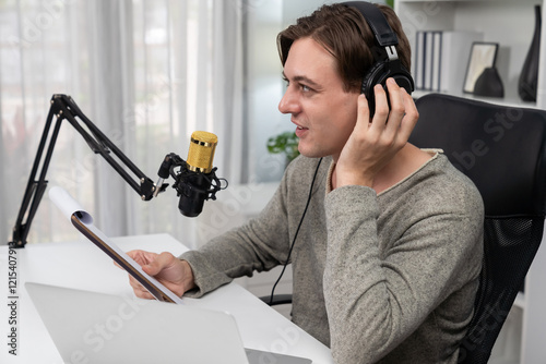 Host channel in smart broadcaster with talking show on live social media streaming with script note reading to listeners, wearing headphones to record video streamer at modern home studio. Pecuniary. photo