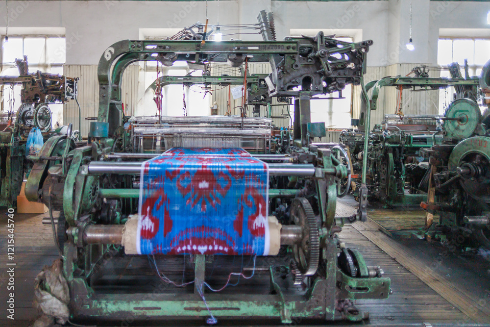 Fototapeta premium A loom with a carpet in the process of sewing.
