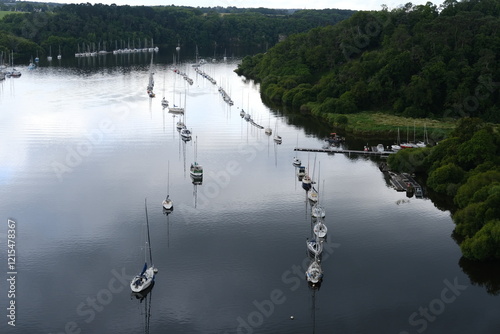  An aerial view of some boat moored in the Vilaine River. La Roche-Bernard, France - June 10, 2024. 