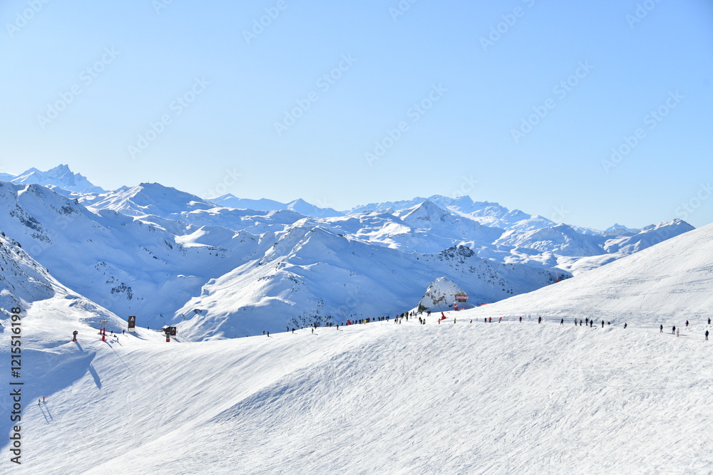 Obraz premium Skiers on the slopes of Courchevel ski resort,French alps.