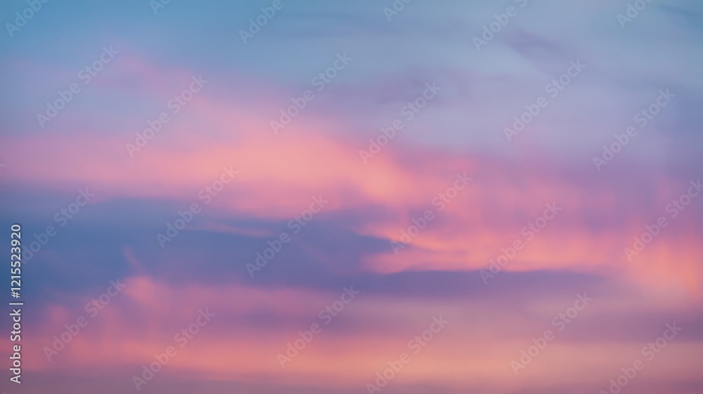 Fototapeta premium A serene sky painted with soft hues of pink and blue, creating a tranquil atmosphere at dusk.