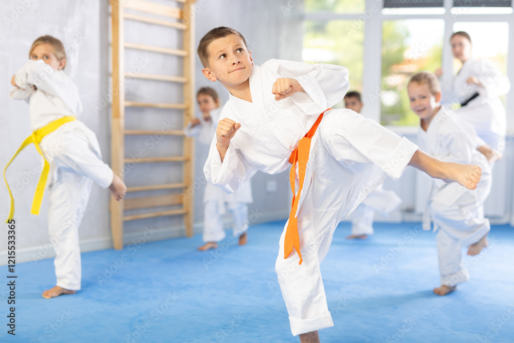 Kata karate teacher conducts classes and performs movements and fighting techniques together with boys and girls students to prepare them for competitions. Kata karate teacher conducts classes and performs movements and fighting techniques together with boys and girls students to prepare them for competitions.