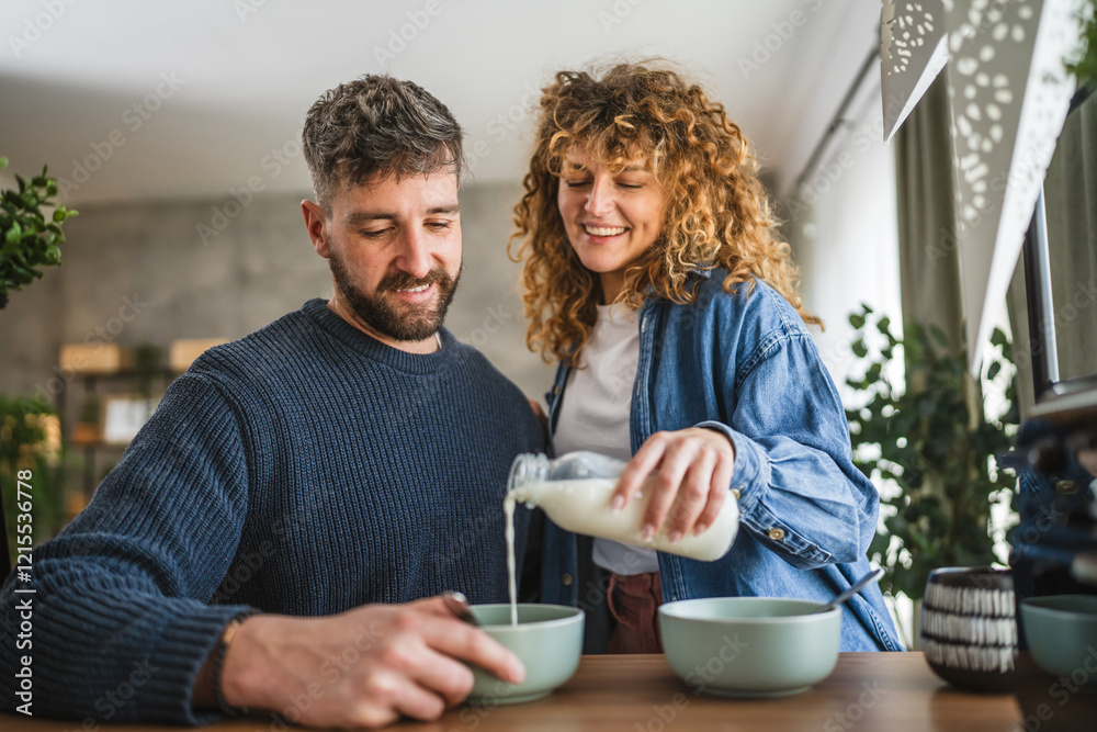 happy couple prepare oatmeal with milk for breakfast together at home happy couple prepare oatmeal with milk for breakfast together at home