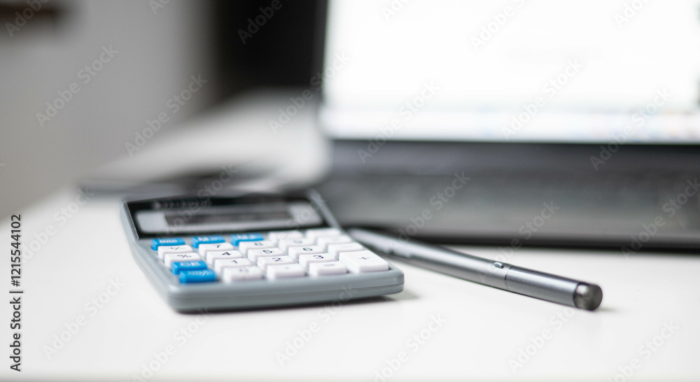 Laptop computer with calculator and smartphones Laptop computer with calculator and smartphones