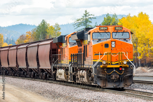 Wallpaper Mural a freight train traveling on a beautiful day in autumn near Whitefish, Montana Torontodigital.ca