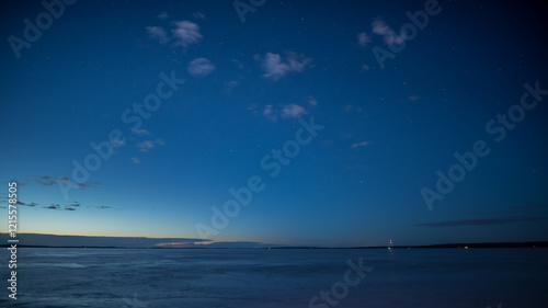 Blue night scenery over the frozen lake Näsijärvi in Tampere, Finland