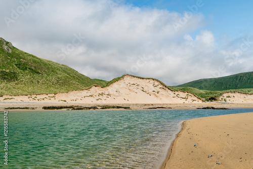 Five Finger Strand, one of the most famous beaches in Inishowen known for its pristine sand and rocky coastline with some of the highest sand dunes in Europe, county Donegal, Ireland. photo