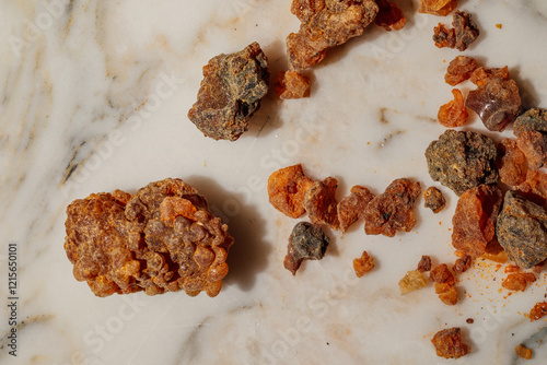 Φωτογραφία myrrh resin, dried sap nuggets of the Commiphora myrrha, on white marble