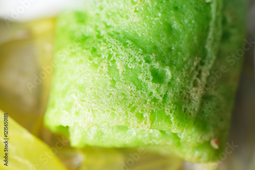 Konstfotografi Coconut grated Pandan crepe know as Kuih Dadar
