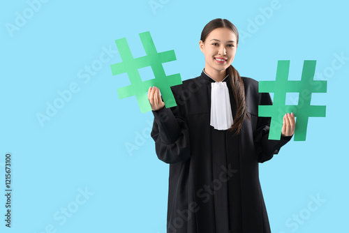 Young female judge in robe ...