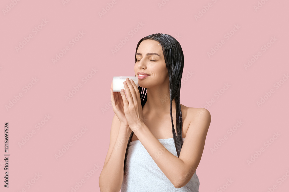 Beautiful young happy woman with jar of hair mask on pink background Beautiful young happy woman with jar of hair mask on pink background