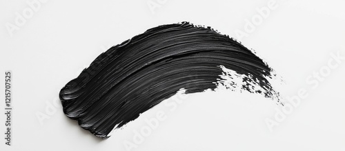 Black paint smear on a white background with texture detail and ample Copy Space for text placement. photo