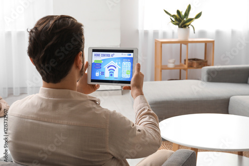 Young man with smart home s...