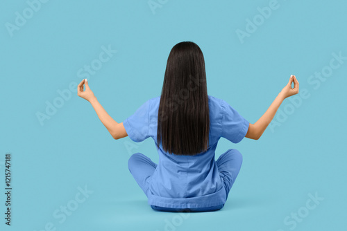 Young female doctor meditat...