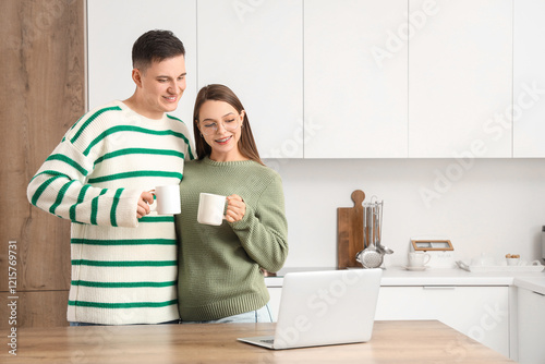 Cute young couple in warm s...