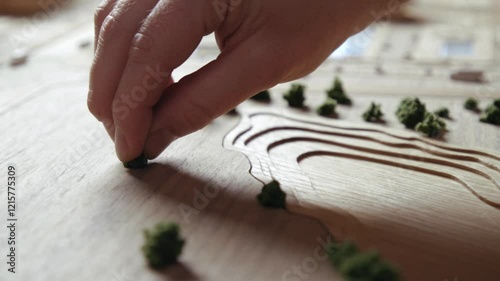 Caucasian Man Building Architecture Model by Hands Close Up. Adult Person Constructing Town and Making Wooden Landscape with Nature. Worker Crafts Tech Prototype of Eco Friendly Lifestyle for People