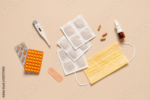 Mustard plasters with medical supplies on beige background photo