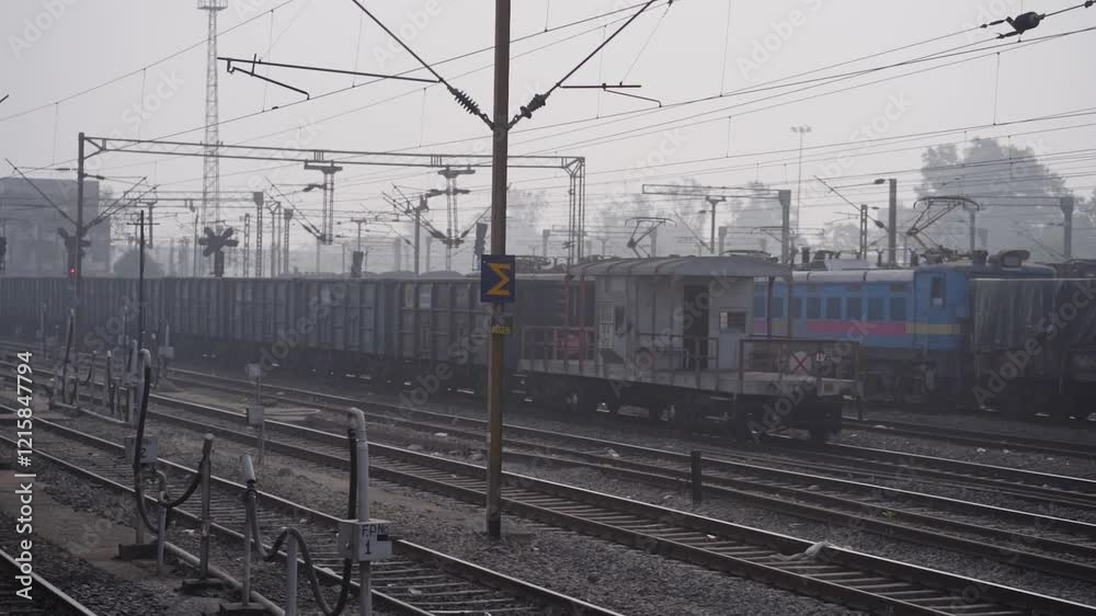 train journey with cargo view, moving train capturing freight wagons, railway tracks and cargo carriages, scenic train travel perspective, freight train alongside tracks, electric railway line view. train journey with cargo view, moving train capturing freight wagons, railway tracks and cargo carriages, scenic train travel perspective, freight train alongside tracks, electric railway line view.