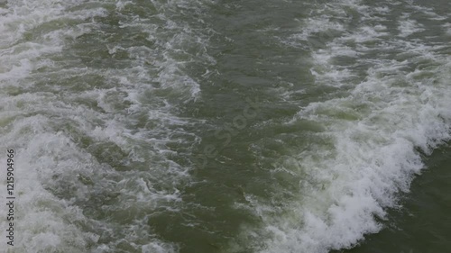 Slow motion waves on the foggy river Danube in Austria in autumn