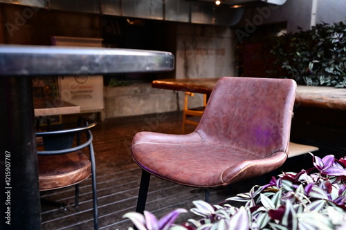 The restaurant’s modern outdoor area is furnished with premium leather chairs, elevating both the dining experience and the visual appeal of the space. photo