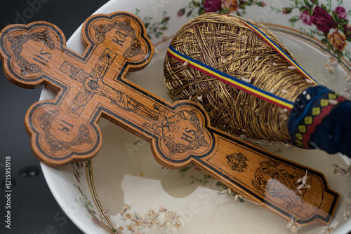 Bilde på lerret Holy water and an Orthodox cross used in the Orthodox church in Romania for blessing and protection