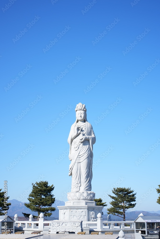 a stone statue of the Buddha a stone statue of the Buddha