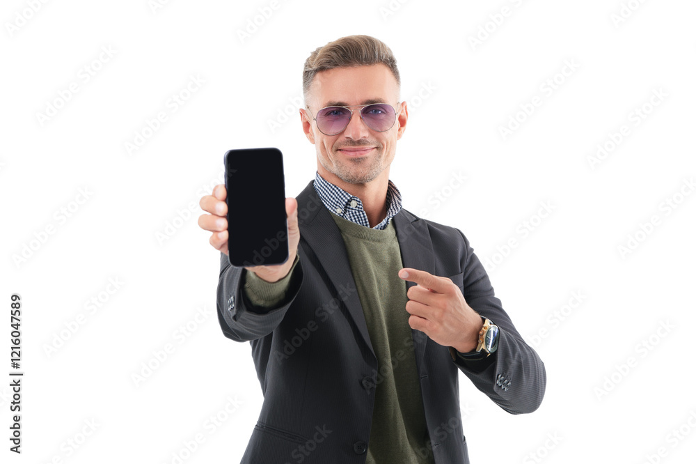 Mature business man presenting phone screen. Businessman man pointing finger on phone isolated on white. Man showing new business phone app. Presenting product. Advertisement of business app Mature business man presenting phone screen. Businessman man pointing finger on phone isolated on white. Man showing new business phone app. Presenting product. Advertisement of business app