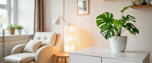 Tropical indoor plant on sleek sideboard in minimalist living room, relaxation photo