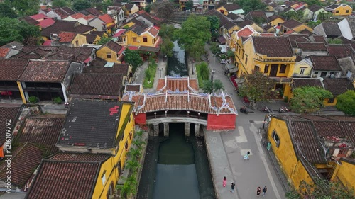 Aerial view of Chua Cau or Japanese Covered ancient Bridge and River in Old city of Hoi An, Vietnam. Vietnamese heritage and culture in Hoian ancient town