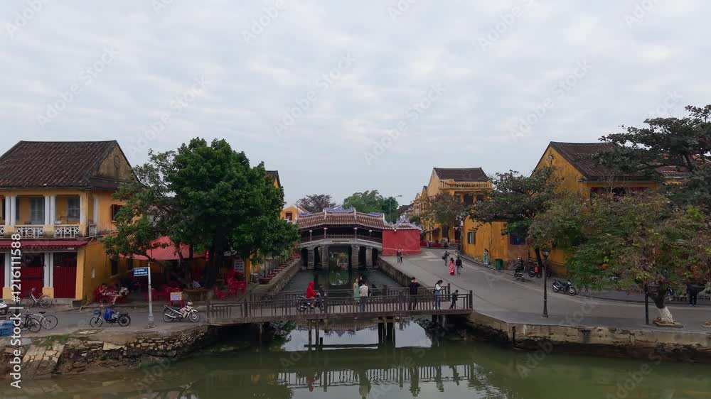 Aerial view of Chua Cau or Japanese Covered ancient Bridge and River in Old city of Hoi An, Vietnam. Vietnamese heritage and culture in Hoian ancient town Aerial view of Chua Cau or Japanese Covered ancient Bridge and River in Old city of Hoi An, Vietnam. Vietnamese heritage and culture in Hoian ancient town