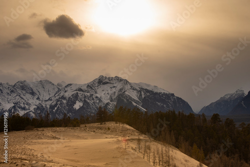 Russia. Beautiful scenery of the northernmost desert in the world. View of the Kodar Ridge. Chara sands. The region of baikaL Kodar National natural park.