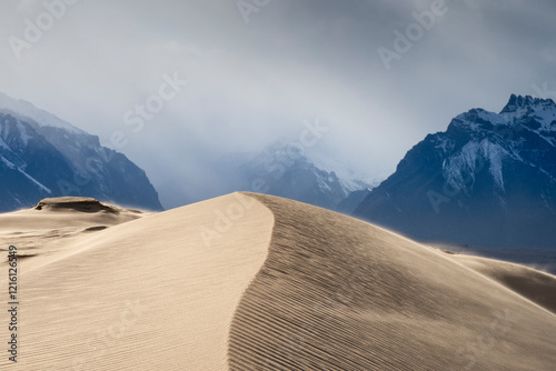 Russia. Beautiful scenery of the northernmost desert in the world. View of the Kodar Ridge. Chara sands. The region of baikaL Kodar National natural park. 

