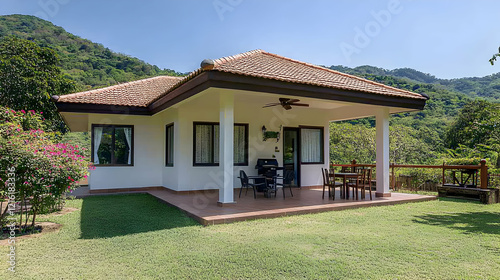 A simple two-story small house with white walls and a gable roof