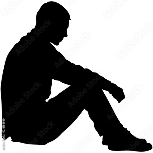 A man is sitting on the ground. He is wearing a black shirt and black pants. He is looking down