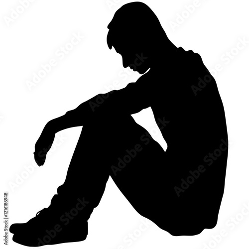 A man is sitting on the ground. He is wearing a black shirt and black pants. He is looking down
