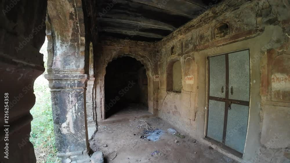 Historic ruins in Achrol village near Jaipur, surrounded by lush, overgrown vegetation, showcasing nature's reclamation Historic ruins in Achrol village near Jaipur, surrounded by lush, overgrown vegetation, showcasing nature's reclamation