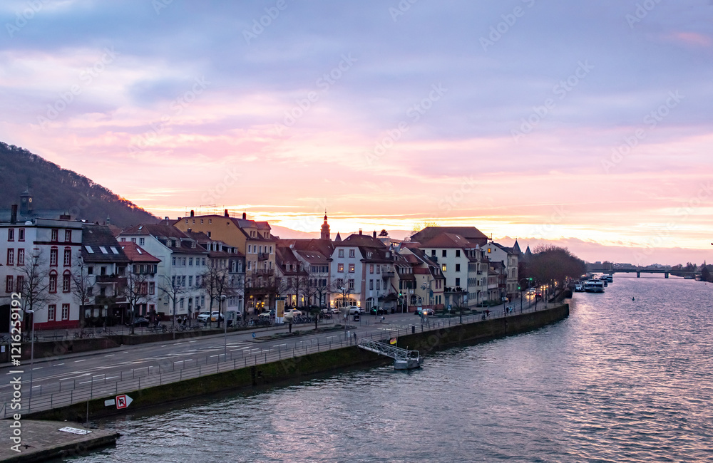 Obraz premium Traditional buildings and residences along the Neckar River in Heidelberg Germany. Photo taken during sunset