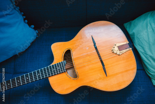 Gypsy acoustic guitar on the sofa photo
