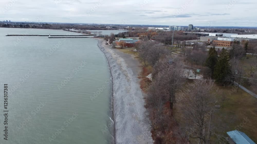 Wide aerial view of Whitby waterfront on lake Ontario with a lighthouse in view. Wide aerial view of Whitby waterfront on lake Ontario with a lighthouse in view.
