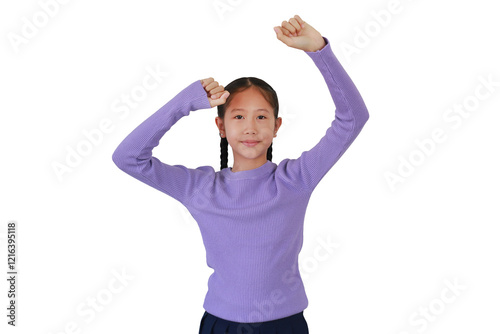Asian girl celebrating make cheer, dancing or enjoy gesture isolated on white studio background. Confident child hands up raised arms.