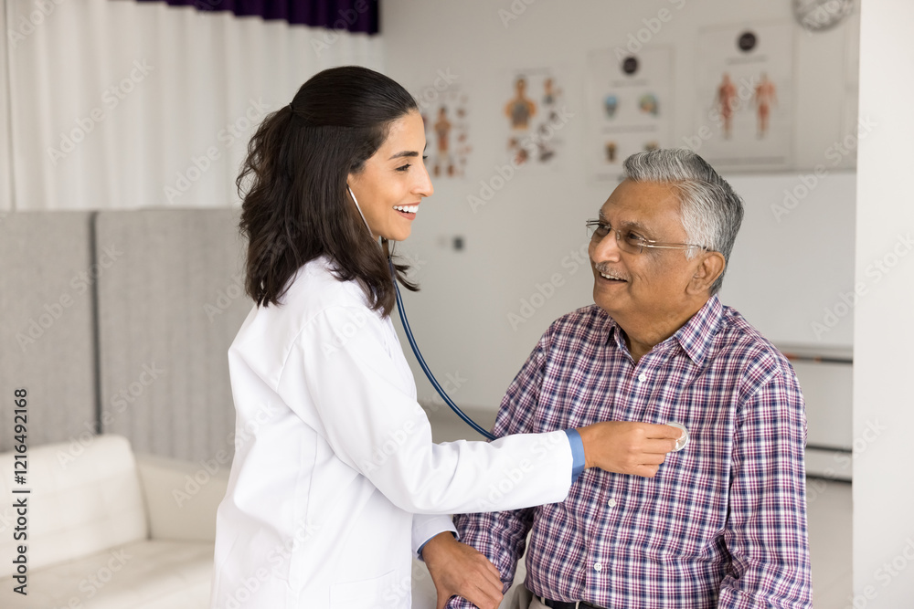 Fototapeta premium Regular cardio checkup. Friendly woman doctor therapist cardiologist examine mature man retiree health at cardiology clinic office listen to heart lungs using phonendoscope test pulse on patient wrist