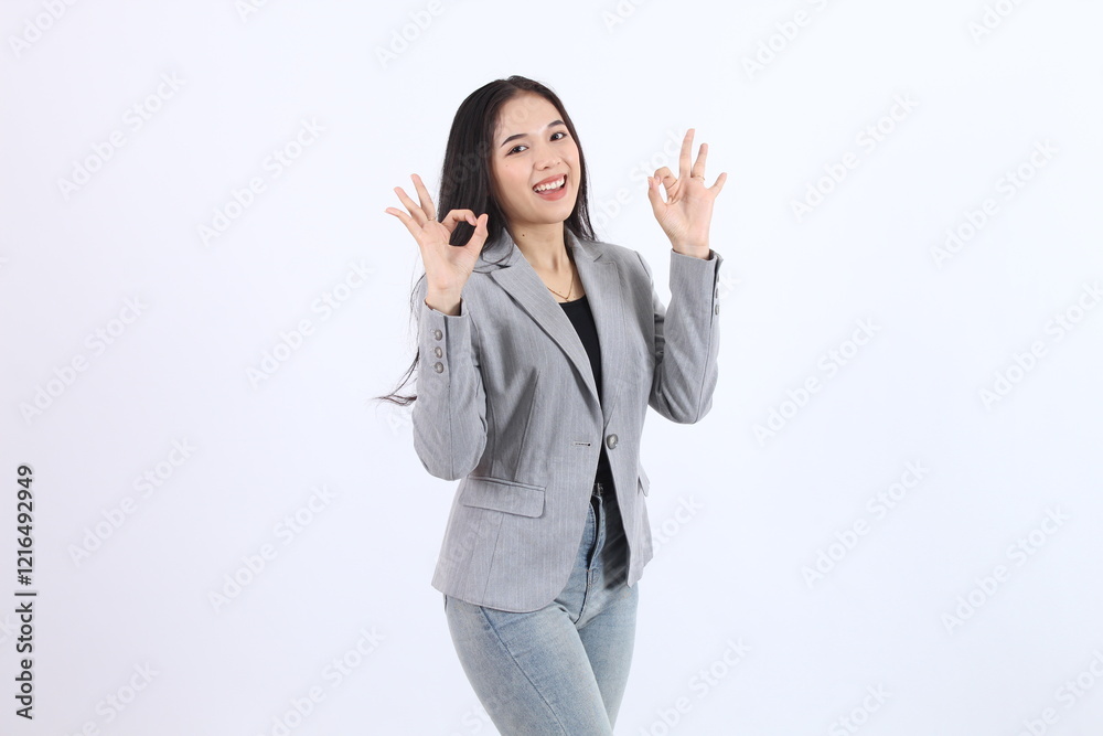 Confident Businesswoman Shows OK Sign: Success, Agreement, and Approval in Business Confident Businesswoman Shows OK Sign: Success, Agreement, and Approval in Business