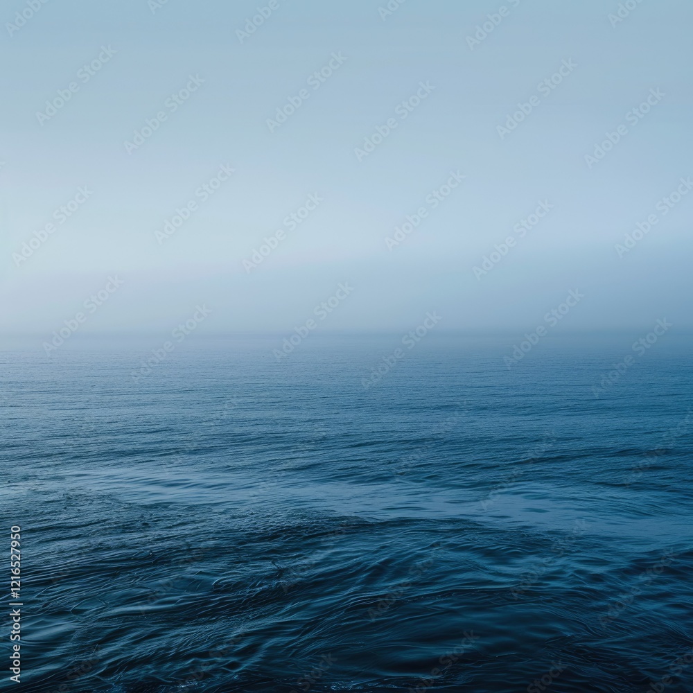 Fototapeta premium A serene seascape featuring calm waters and a gradient sky.