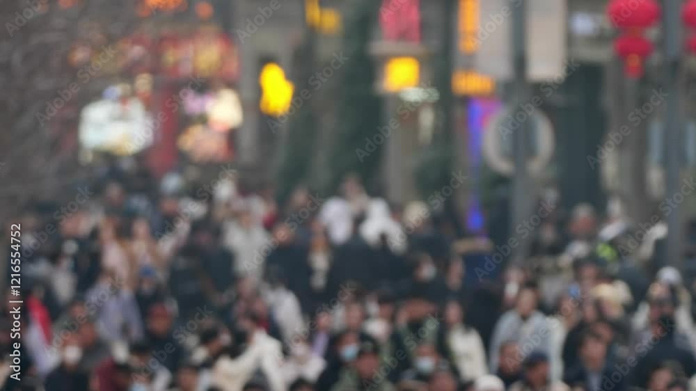 High angle view of unfocused blurry crowded people walking on Nanjing road, the most crowded road in Shanghai. 4k slow motion footage telephoto lens B roll shot, anonymous Pedestrian People Walking. High angle view of unfocused blurry crowded people walking on Nanjing road, the most crowded road in Shanghai. 4k slow motion footage telephoto lens B roll shot, anonymous Pedestrian People Walking.