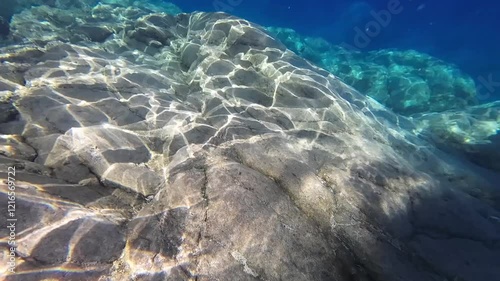 Underwater survey of the seabed. Paddle in blue water