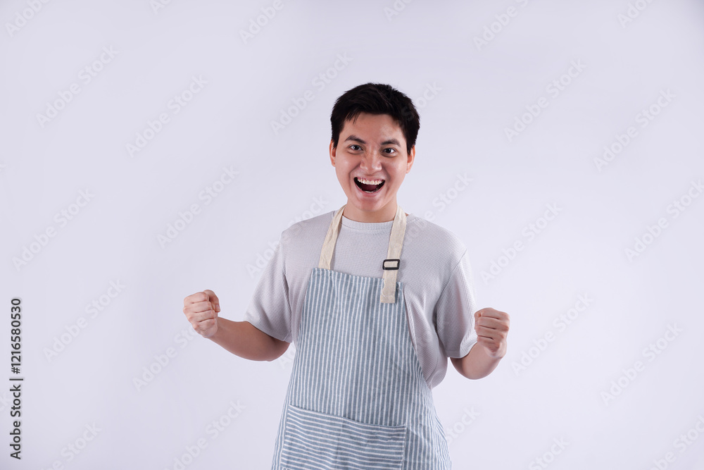 Portrait of young Asian man wearing apron and posing on white background Portrait of young Asian man wearing apron and posing on white background