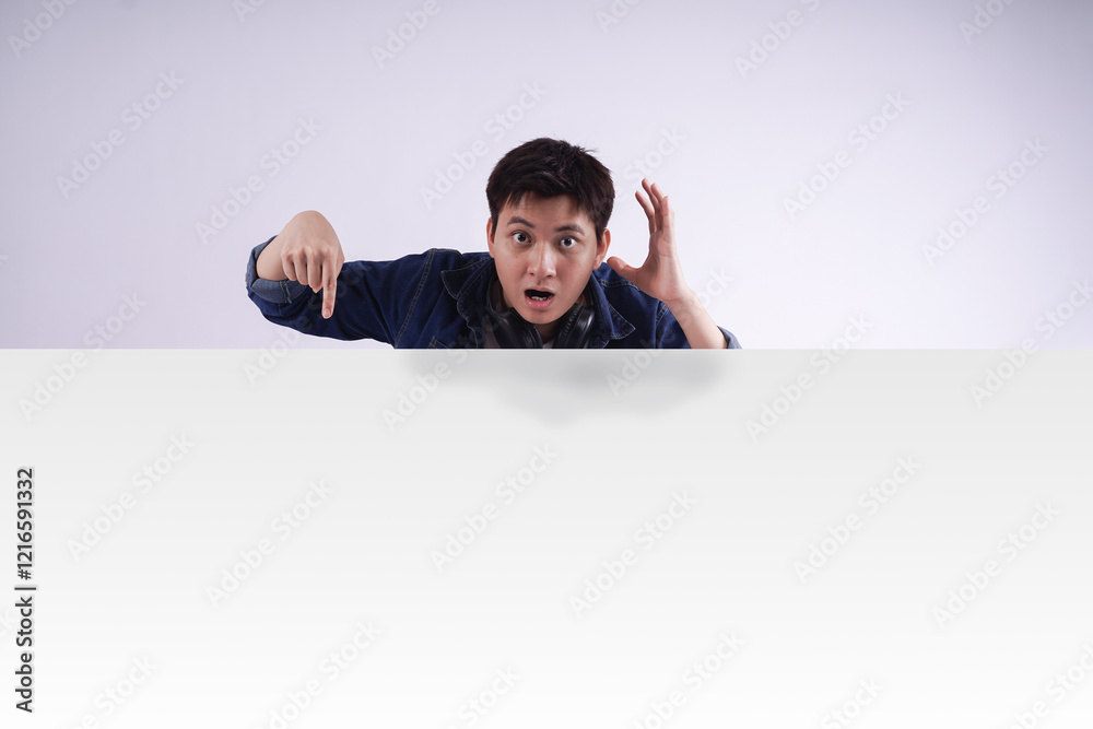 image of Asian man standing and posing with billboard image of Asian man standing and posing with billboard