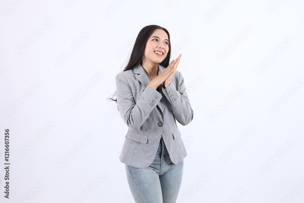 Happy Asian business woman clapping hands in a formal blazer, celebrating success confidently Happy Asian business woman clapping hands in a formal blazer, celebrating success confidently